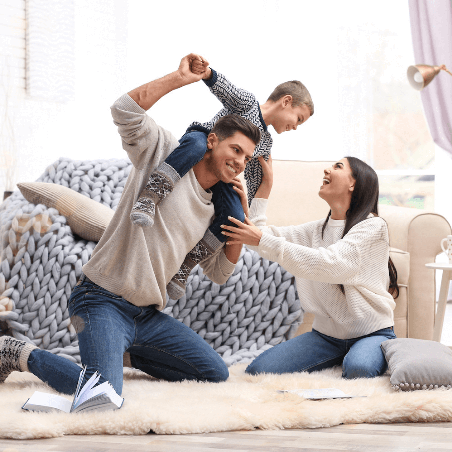 Happy family with new roof and home