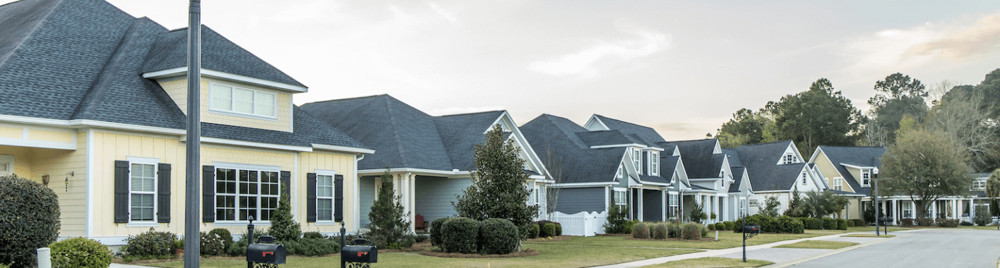 Asphalt shingle rooftops in residential neighborhood
