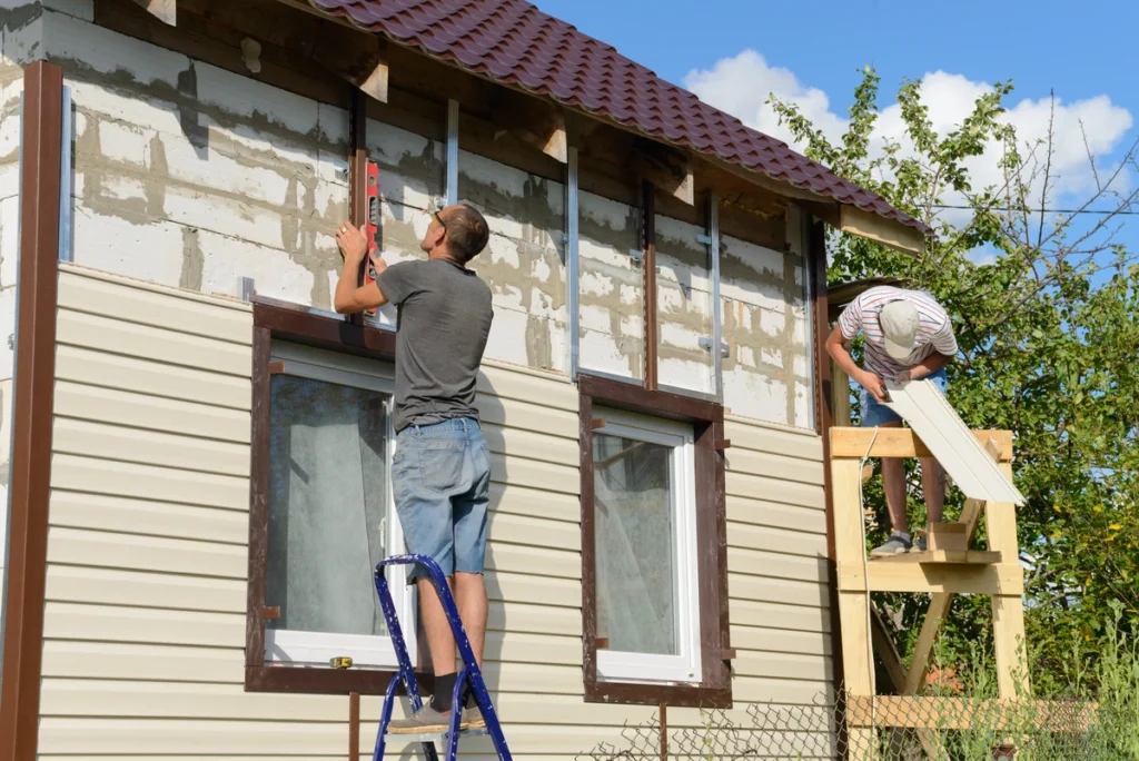 siding contractors installing james hardie siding in neutral color