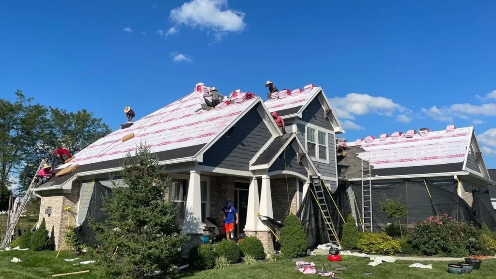 open box contractors on residential rooftop during replacement