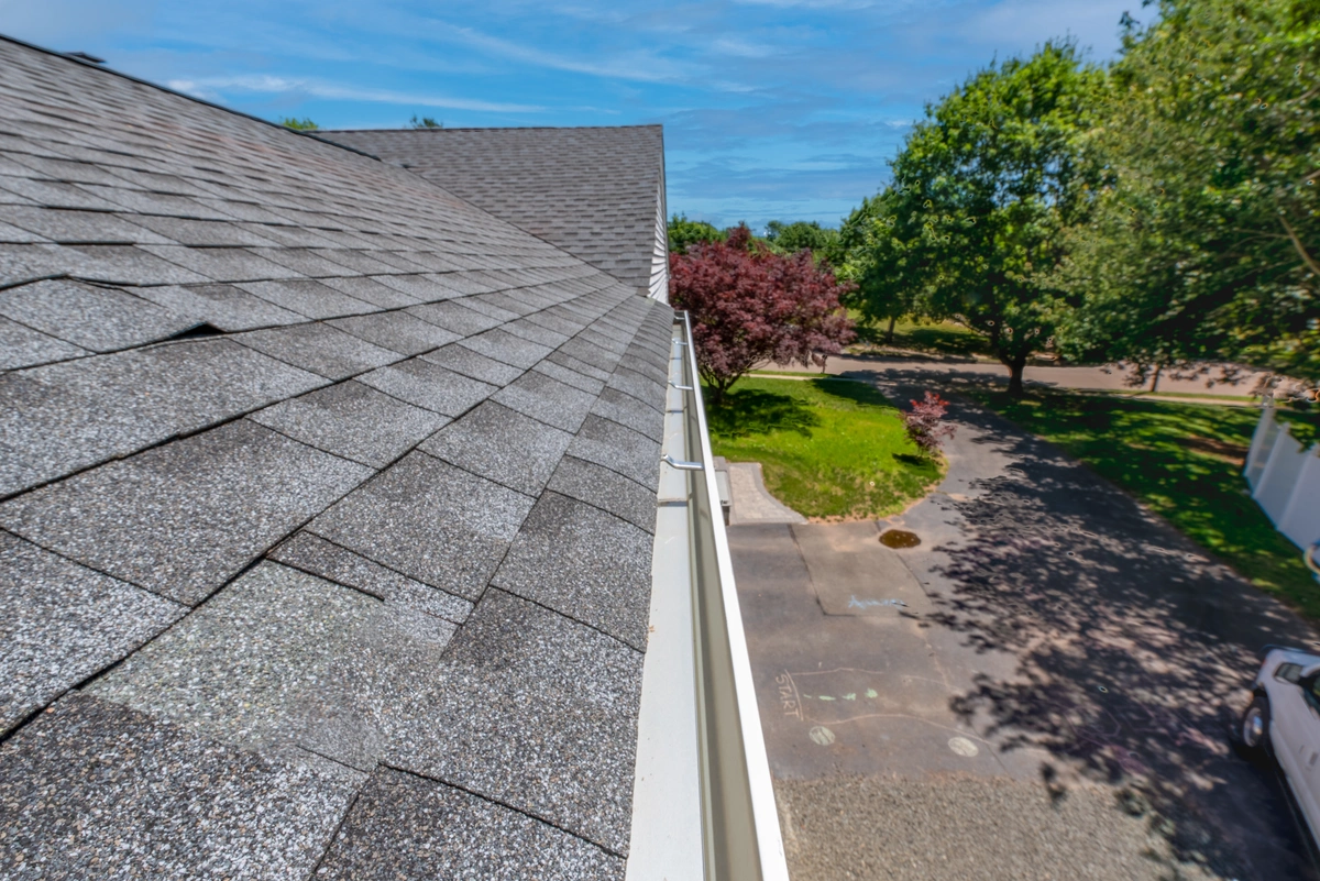 side view of well maintained asphalt shingle roof