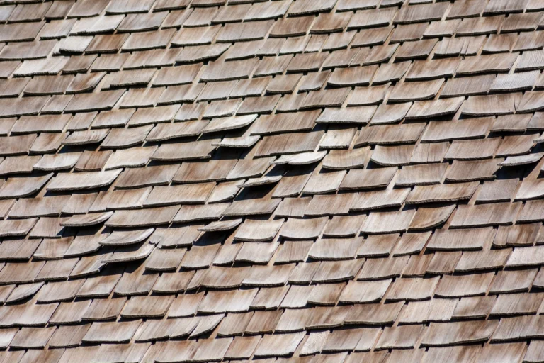 damaged traditional wooden roof shingles