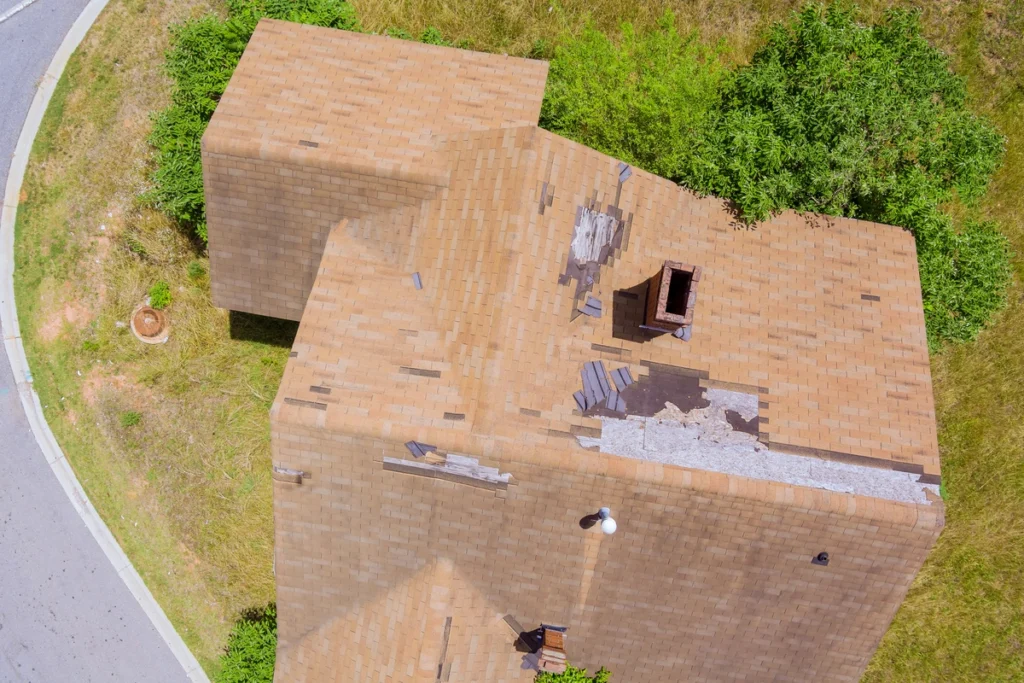 bird view of house roof with missing shingles