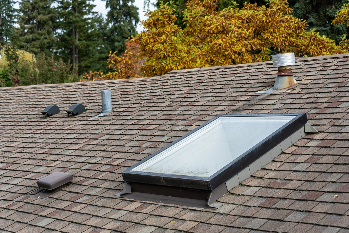 Various types of roof vents on a shingle roof