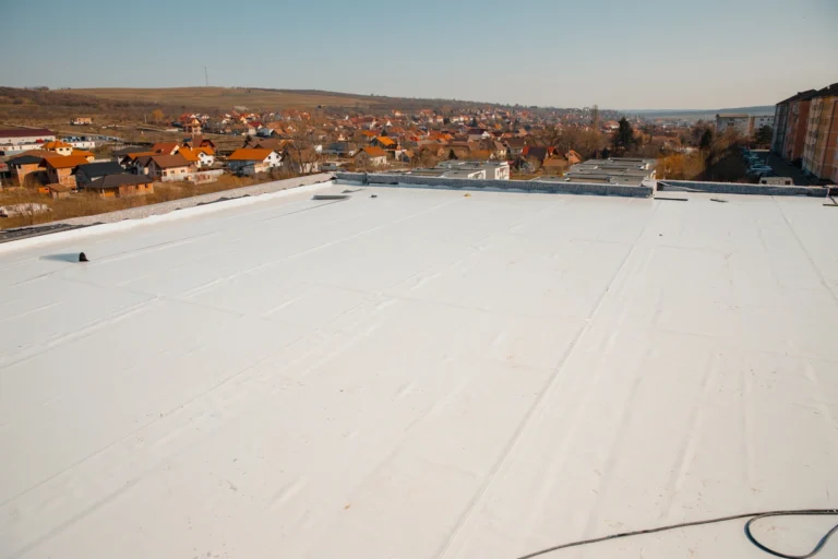 Aerial view of a flat roof with a town in the distance