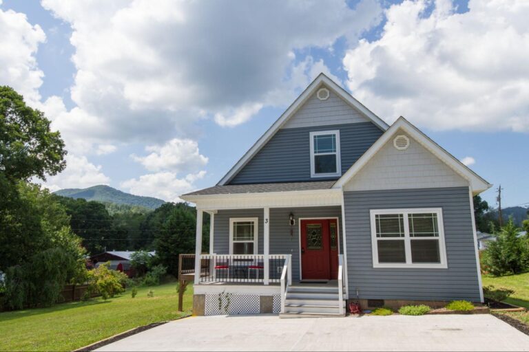 a blue house with complete siding